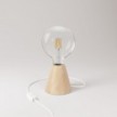 Table lamp with alder base and transparent light bulb