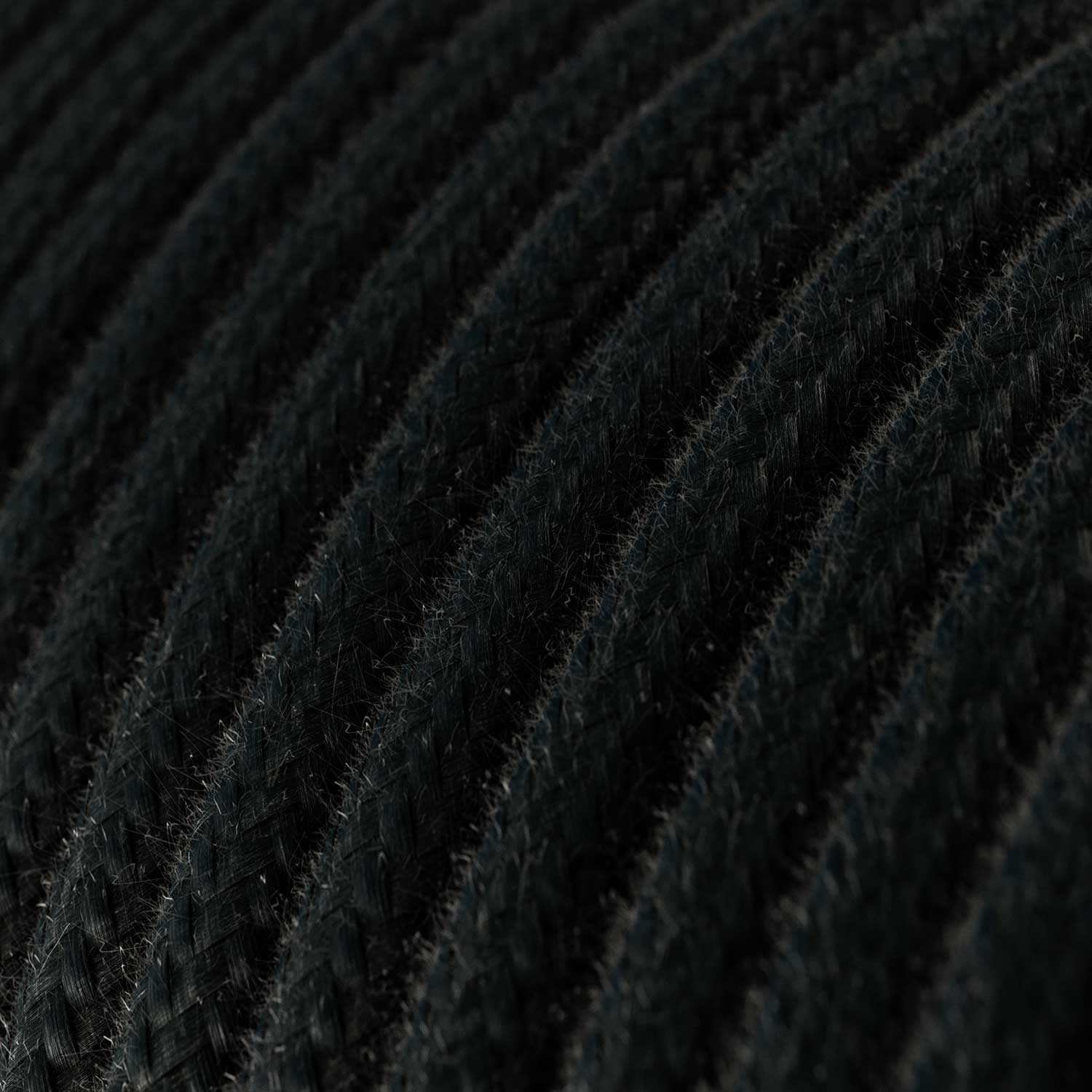 Lámpara colgante de silicona colorida con cable textil.